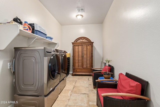 clothes washing area featuring washing machine and dryer