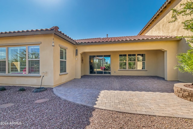 rear view of house featuring a patio