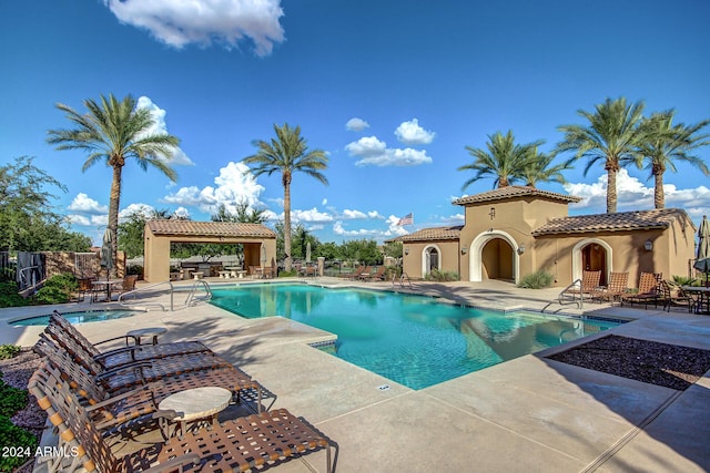 view of swimming pool with a patio area