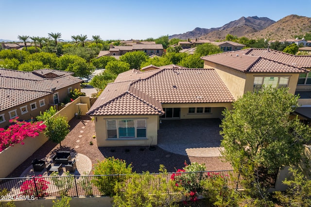 birds eye view of property with a mountain view