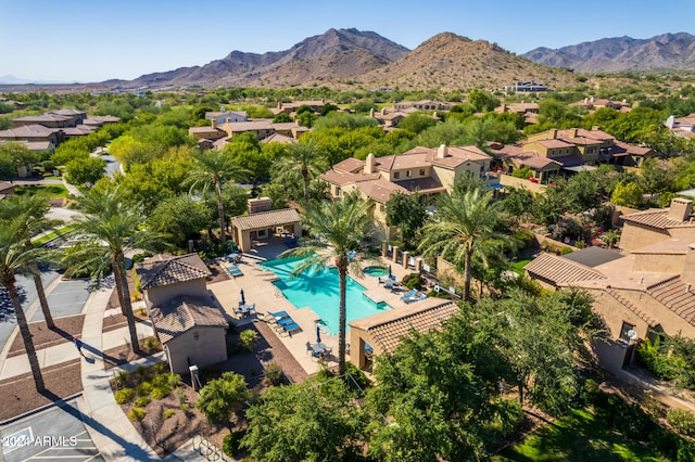 birds eye view of property with a mountain view