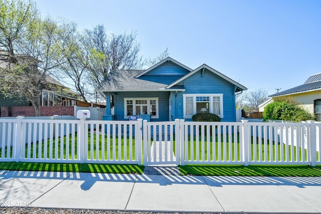306 N Virginia St, Prescott, AZ 86301 - bungalow-style home featuring a shingled roof, a gate, a front lawn, and a fenced front yard