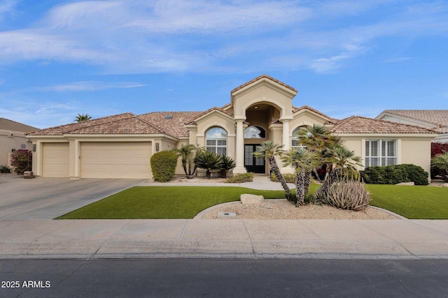 mediterranean / spanish home with stucco siding, driveway, and a tile roof