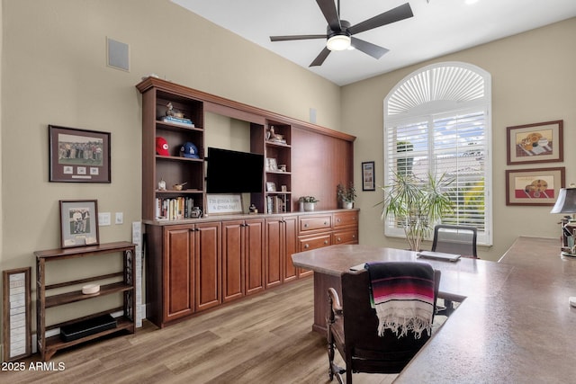 office area featuring light wood-style flooring, visible vents, and ceiling fan