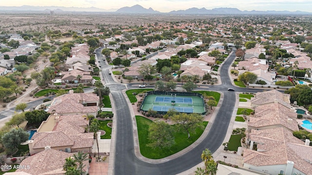 birds eye view of property with a mountain view and a residential view