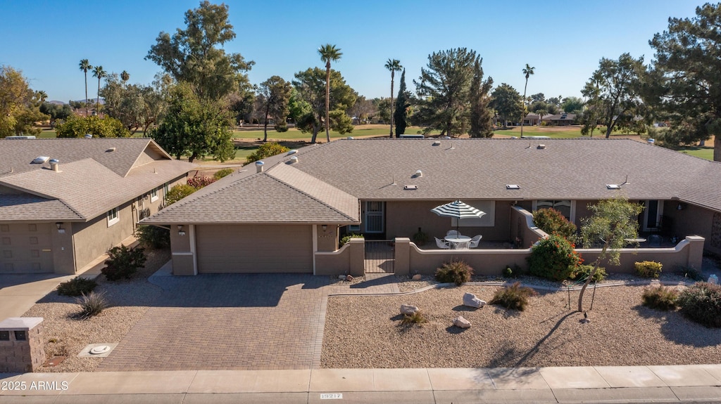 19217 N Concho Cir, Sun City, AZ 85373 - ranch-style home featuring a garage