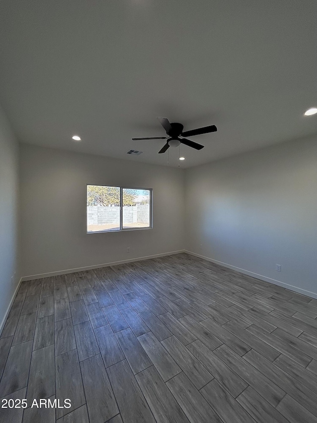 spare room with ceiling fan