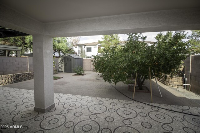 20221 N 31st St, Phoenix, AZ 85050 - view of patio with a storage shed, an outdoor structure, and a fenced backyard
