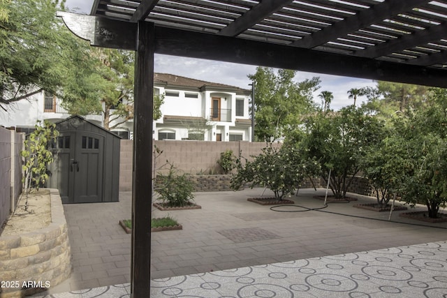 20221 N 31st St, Phoenix, AZ 85050 - view of patio / terrace featuring a shed, a fenced backyard, an outdoor structure, and a pergola