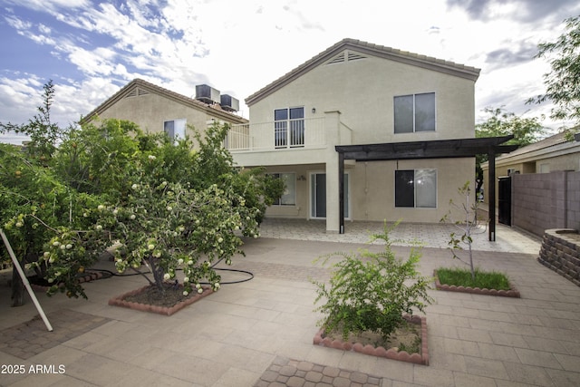 20221 N 31st St, Phoenix, AZ 85050 - rear view of house featuring a patio, stucco siding, central air condition unit, fence, and a pergola