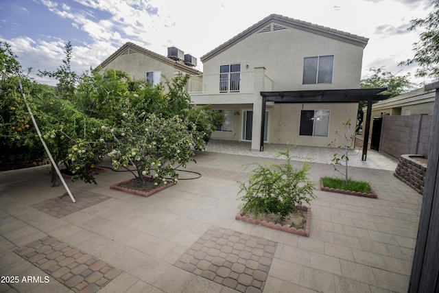20221 N 31st St, Phoenix, AZ 85050 - back of property featuring a patio area, stucco siding, fence, and a balcony