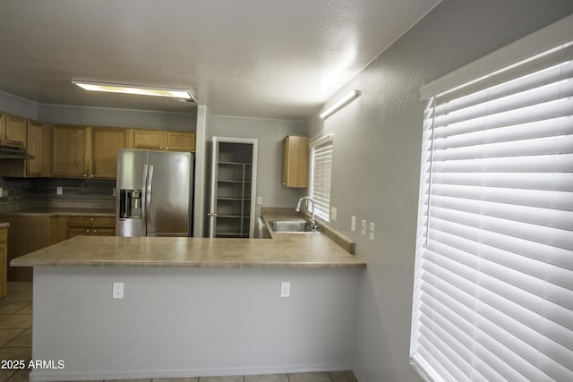 20221 N 31st St, Phoenix, AZ 85050 - kitchen with stainless steel fridge with ice dispenser, a sink, tile patterned floors, a peninsula, and light countertops
