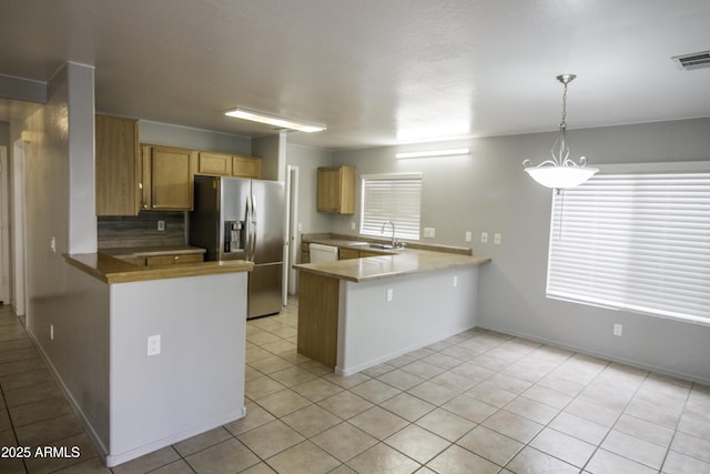 20221 N 31st St, Phoenix, AZ 85050 - kitchen featuring stainless steel fridge, a peninsula, a sink, and light tile patterned floors