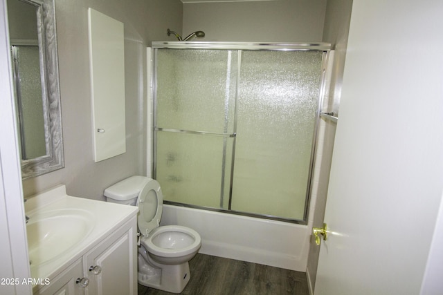 20221 N 31st St, Phoenix, AZ 85050 - bathroom with wood finished floors, vanity, combined bath / shower with glass door, and toilet