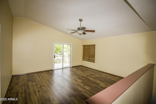 20221 N 31st St, Phoenix, AZ 85050 - unfurnished room featuring vaulted ceiling, a ceiling fan, dark wood-type flooring, and baseboards