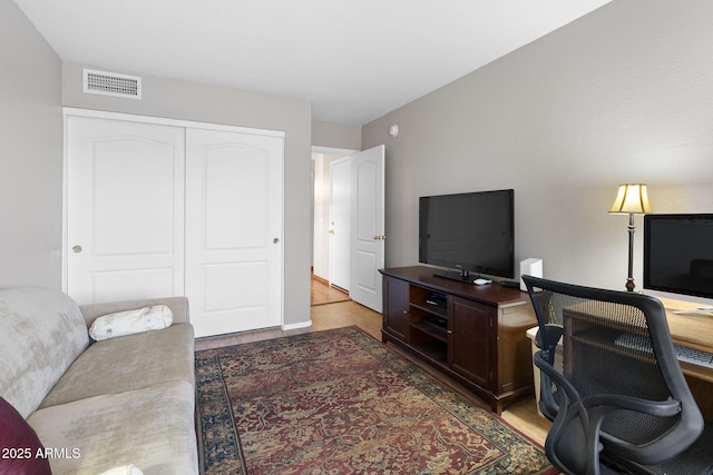 home office with hardwood / wood-style floors