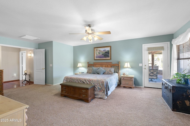 carpeted bedroom featuring access to exterior and ceiling fan