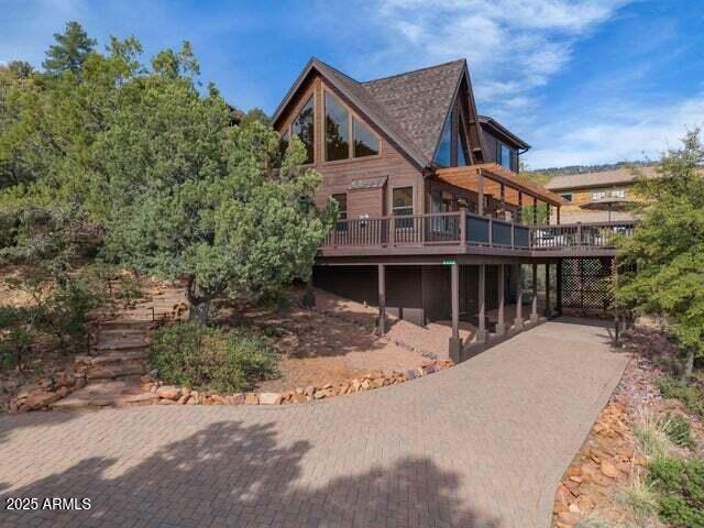 back of house featuring a deck
