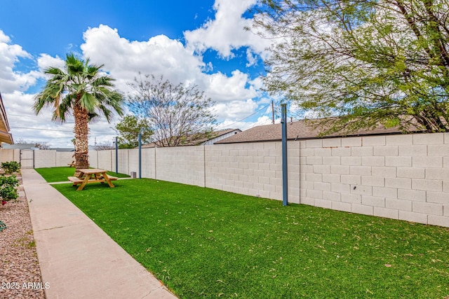 view of yard with a fenced backyard