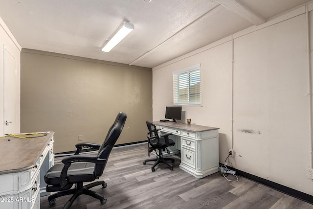 office featuring light wood-type flooring and baseboards