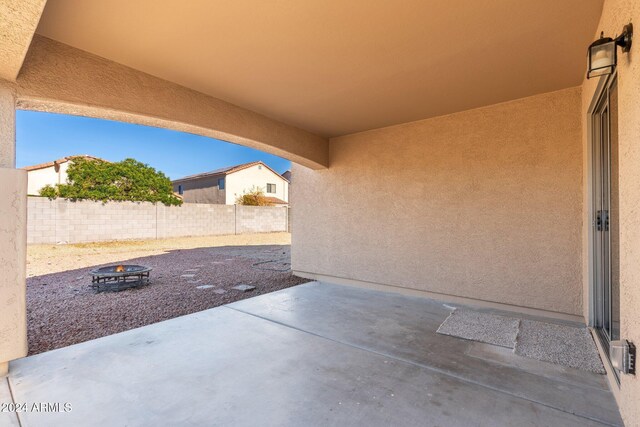 view of patio / terrace featuring a fire pit