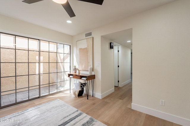 interior space featuring wood finished floors, visible vents, baseboards, ceiling fan, and recessed lighting
