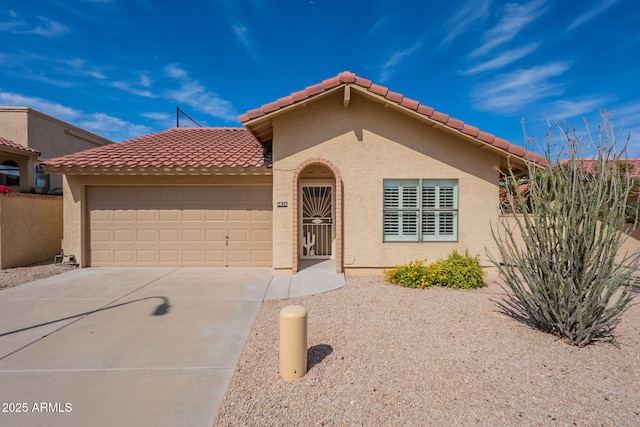 view of front of home with concrete driveway, stucco siding, and a garage
