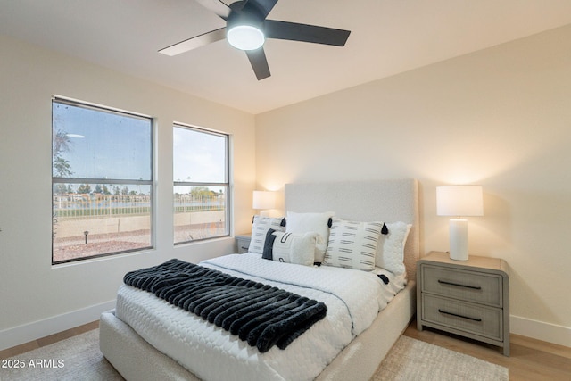 bedroom featuring baseboards and a ceiling fan