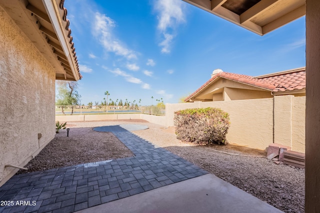 view of yard with a patio area and a fenced backyard