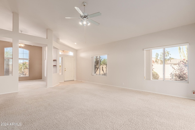 carpeted empty room featuring lofted ceiling and ceiling fan