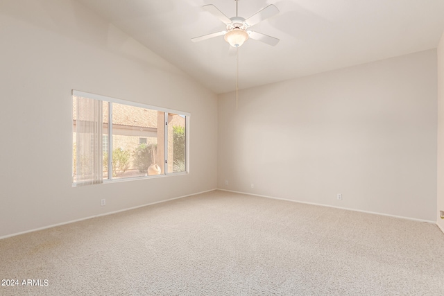 empty room with lofted ceiling, carpet floors, and ceiling fan