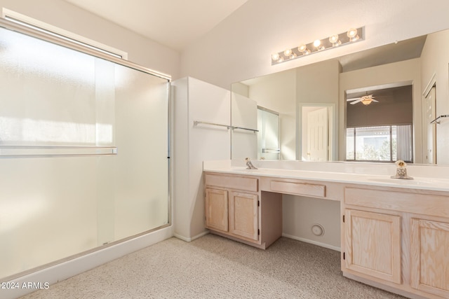 bathroom featuring a shower with door, vanity, and ceiling fan