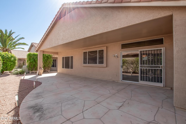 back of property featuring a patio