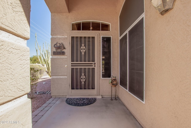 property entrance with a patio area