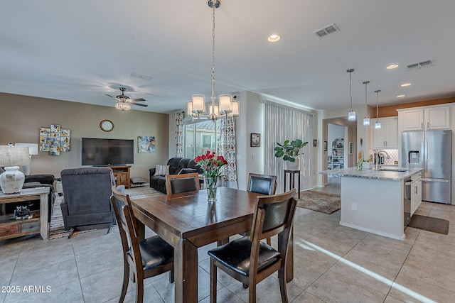 dining space with light tile patterned flooring, recessed lighting, and visible vents