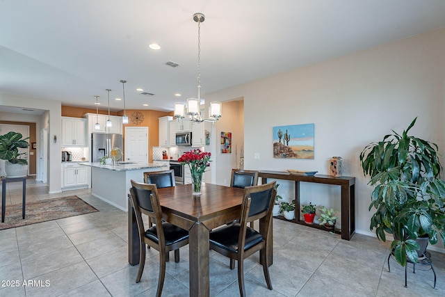 dining room with visible vents, recessed lighting, light tile patterned floors, baseboards, and a chandelier