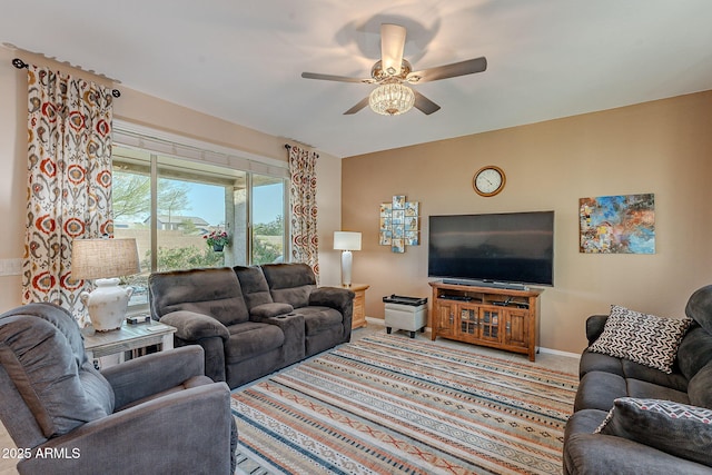 living room featuring carpet flooring, baseboards, and ceiling fan