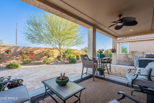 view of patio / terrace featuring outdoor dining area and a ceiling fan