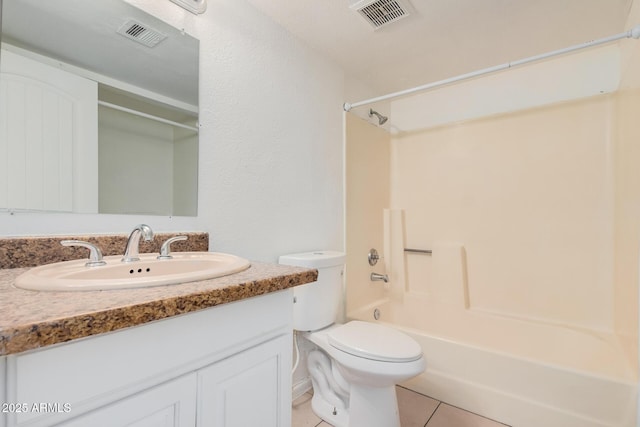 full bathroom with toilet, vanity, tile patterned floors, and tub / shower combination