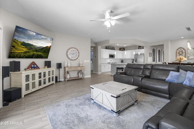 living room with ceiling fan