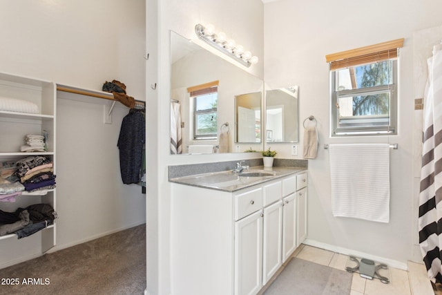 bathroom with tile patterned flooring and vanity