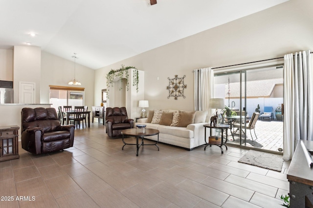 living room featuring lofted ceiling