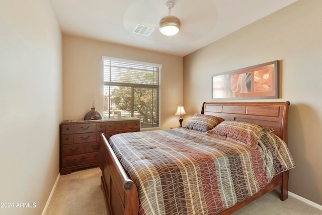 bedroom featuring ceiling fan and light colored carpet