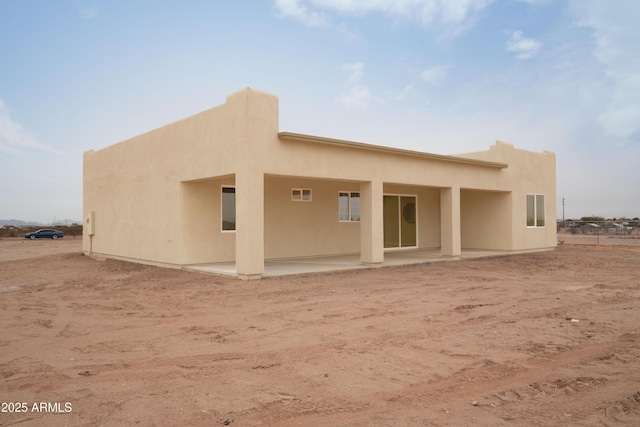 rear view of house featuring a patio area