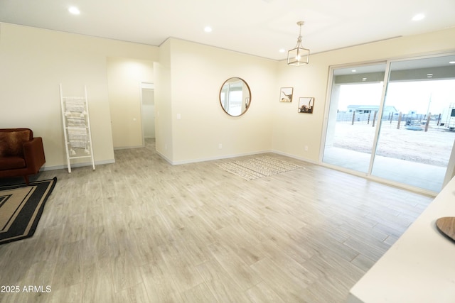 empty room with light hardwood / wood-style flooring