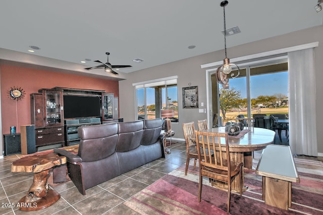 tiled living room with ceiling fan