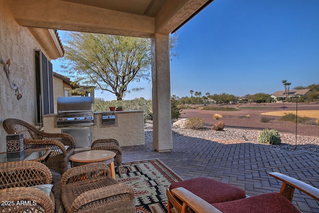 view of patio / terrace featuring an outdoor kitchen and area for grilling