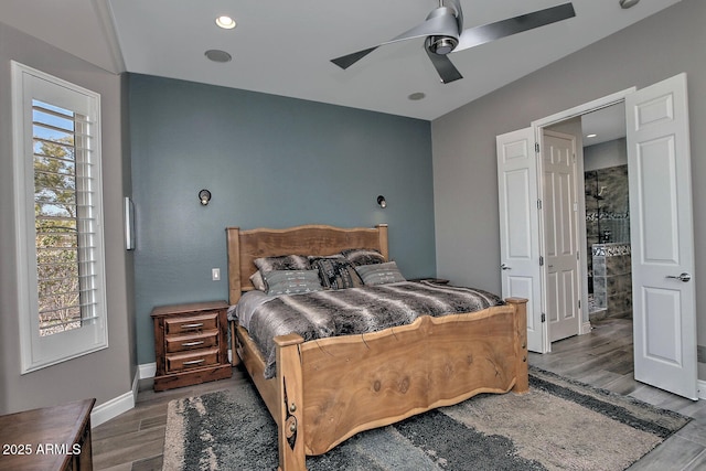 bedroom with ceiling fan and dark hardwood / wood-style flooring