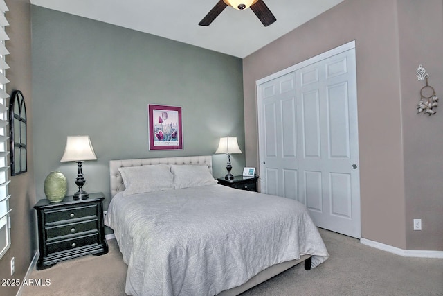 carpeted bedroom with a closet and ceiling fan