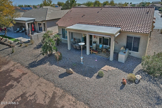 back of house featuring a patio